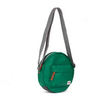    Roka London PADDINGTON Emerald Recycled Nylon Round Bag. OVER THE SHOULDER AND CROSSTOWN, OUR PADDINGTON CROSSBODY IS THE PERFECT ROUND BAG TO SLING ACROSS YOUR BODY AND TAKE ON YOUR DAY