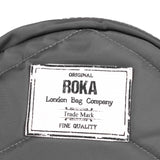 Roka London PADDINGTON Graphite Recycled Nylon Round Bag. OVER THE SHOULDER AND CROSSTOWN, OUR PADDINGTON CROSSBODY IS THE PERFECT ROUND BAG TO SLING ACROSS YOUR BODY AND TAKE ON YOUR DAY