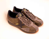 Munich SAPORRO Mens Khaki Leather Trainers A lace-up leather trainer with grey and black cut-out details and subtle Munich branding on the side and tongue. A great casual pairing partner for jeans and chinos.
