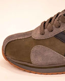 Munich SAPORRO Mens Khaki Leather Trainers A lace-up leather trainer with grey and black cut-out details and subtle Munich branding on the side and tongue. A great casual pairing partner for jeans and chinos.