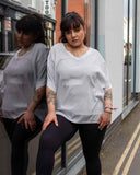 Lottie&Moll ALICE Ladies Grey Satin Edge Stripe Top. A pale silver grey, satin edge, striped, slouchy t-shirt top with a v-neck and kimono short sleeve. A stylish, loose fitting top to pair with any bottom. Crafted for the chic in you, wear this Lottie&Moll ALICE Ladies Grey Satin Edge Stripe Top from desk to drinks. A comfortable, versatile new season wardrobe essential!