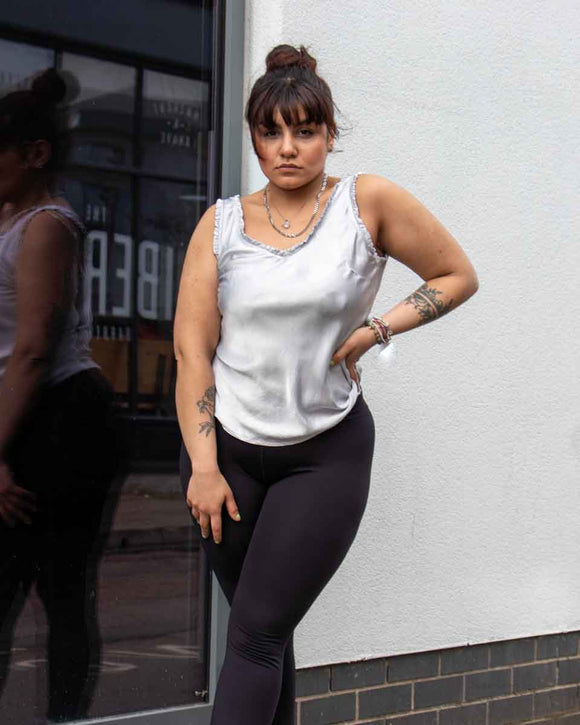 Lottie&Moll AVA Ladies Grey Satin Vest Top. A lovely little satin vest top, in soft silver grey, edged in a small satin frill. Stand out from the crowd this summer in this Lottie&Moll AVA LadiesGrey Satin Vest Top. A perfect summer shorts pairing partner!