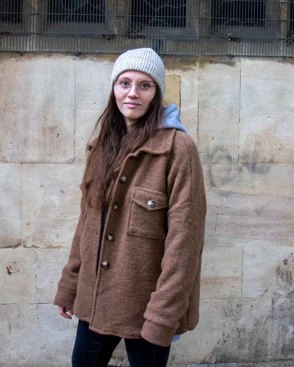 A cosy cross between a shirt and a jacket, wear this Lottie&Moll VAL Ladies Camel Wool Mix Shacket to keep you warm on the coldest of days. With a button front, two big flap front pockets and a curved hemline, shop the shacket look in this cotton and wool mix outer layer. A warm winter must-have!