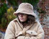 A cosy cross between a shirt and a jacket, wear this Lottie&Moll VEDA Ladies Beige Fake Fur Shacket to keep you warm on the coldest of days. With a button front, two big flap front pockets and a curved hemline, shop the shacket look in this furry cotton and wool mix outer layer. A warm winter must-have!